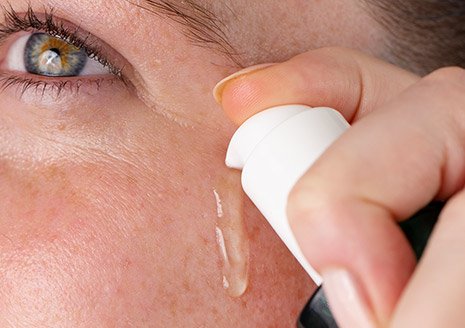women using hemp oil on face